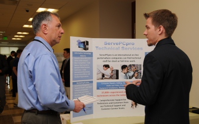 Warren Citrin (left) speaks with a 2013 participant