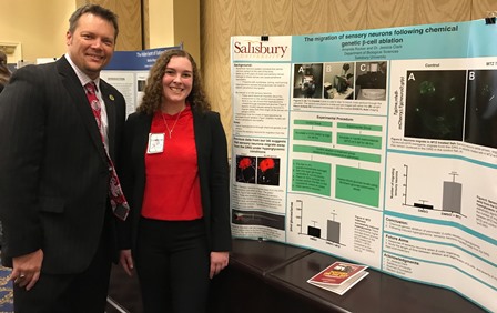 Amanda Rocker of Edgewater, MD, shows her poster to Maryland Delegate Carl Anderton Jr.