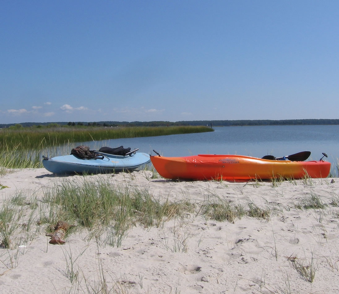 kayaks on bank of water