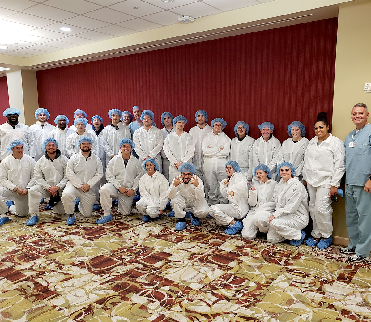 SU Business Students in Scrubs Touring PRMC