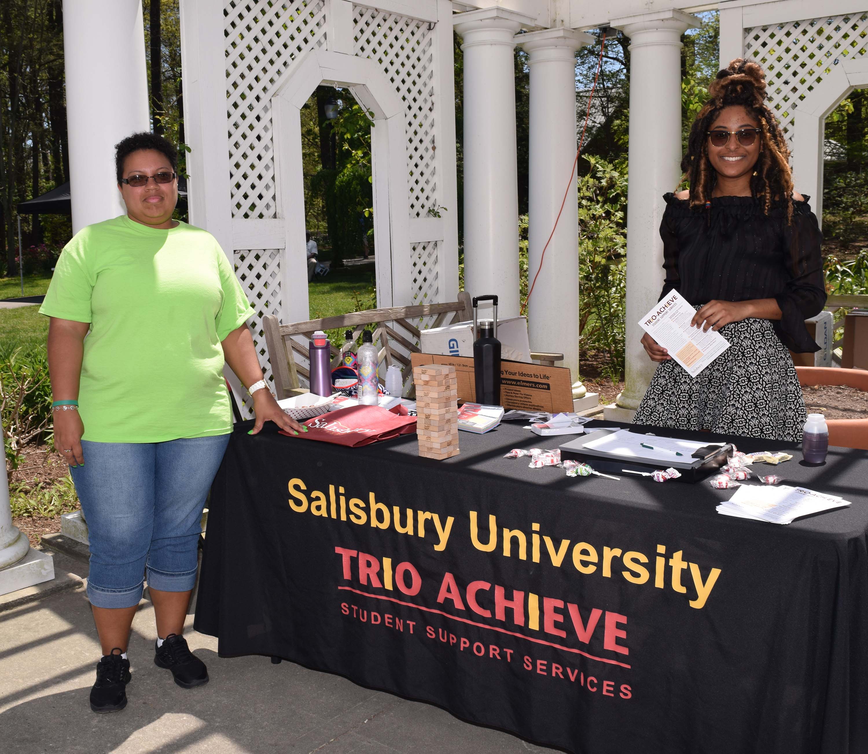 Students with TRIO sign and table