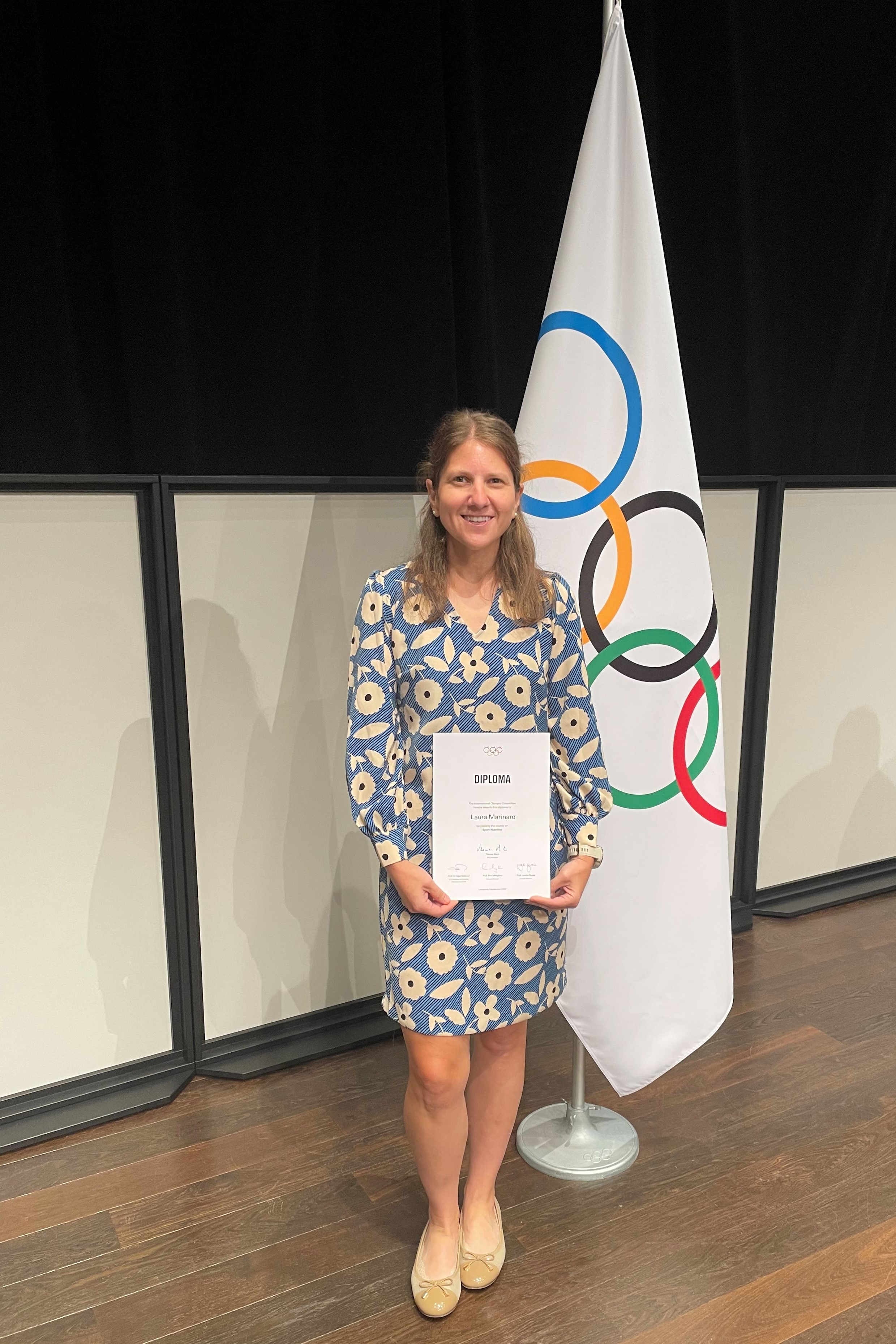 Marinaro with Olympic flag