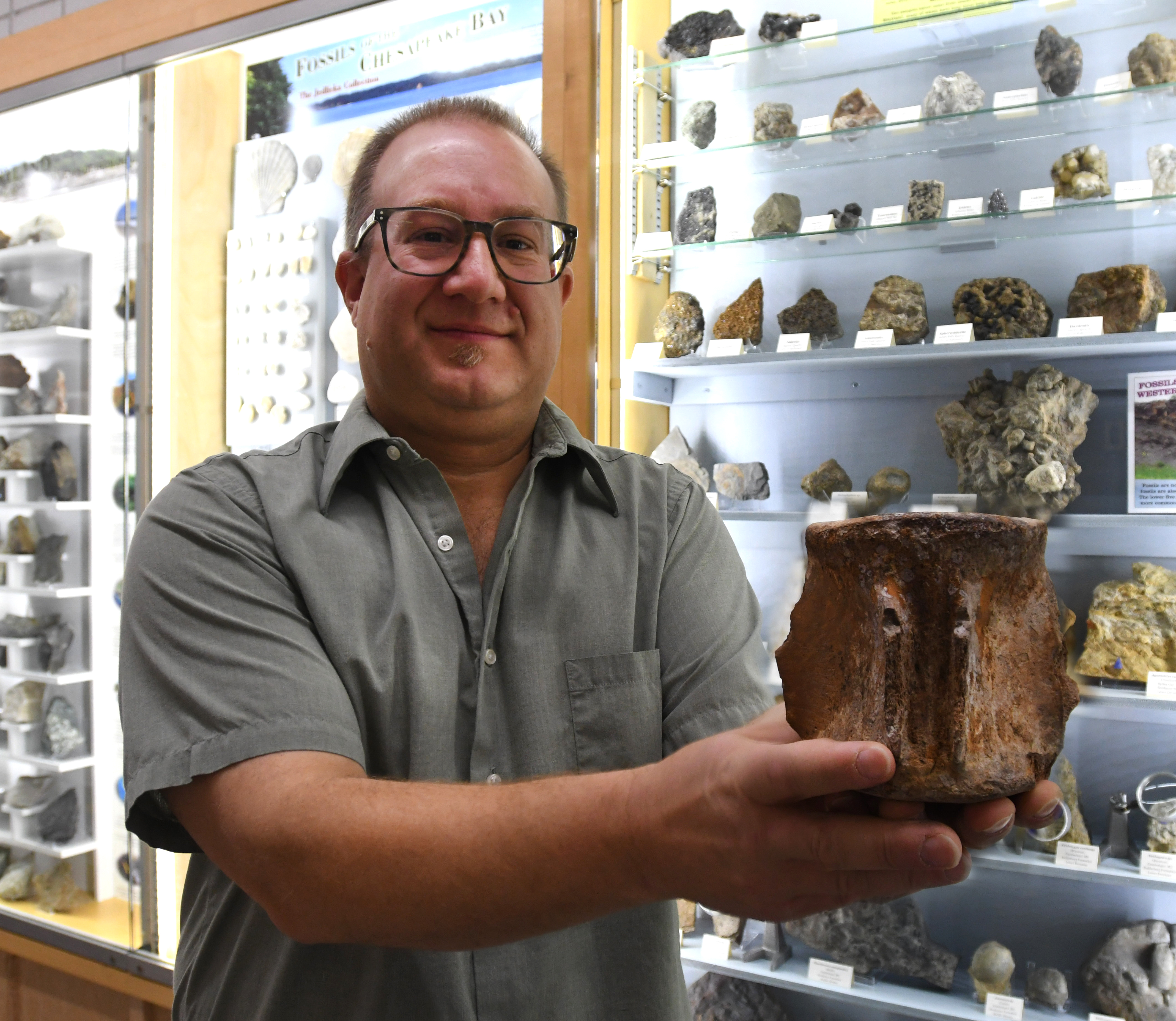 Brent Zaprowski smiling with fossil