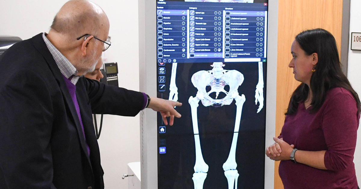 SU Donor Dr. Peter Jackson and SU's Dr. Walter review the Anatomage digital cadaver table