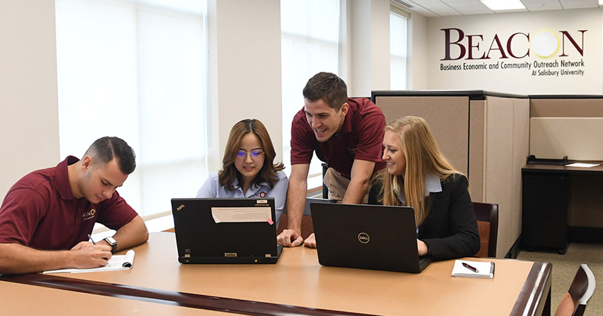 BEACON team members working around a table